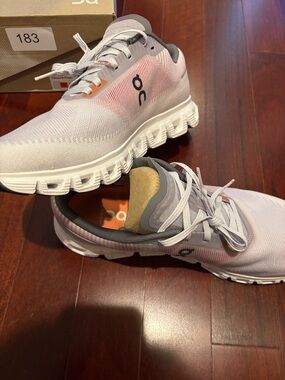 On Running men’s White and Light Pink Cloud Sneakers
